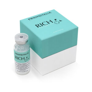 A small clear bottle labeled 'RICH P.L.' next to a turquoise and white product box with the same label.