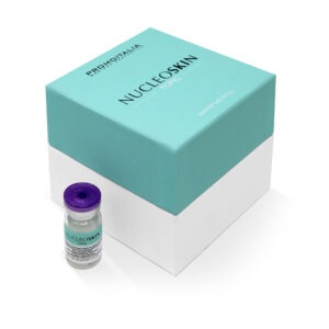 A vial of NucleoSkin product next to its teal packaging box.